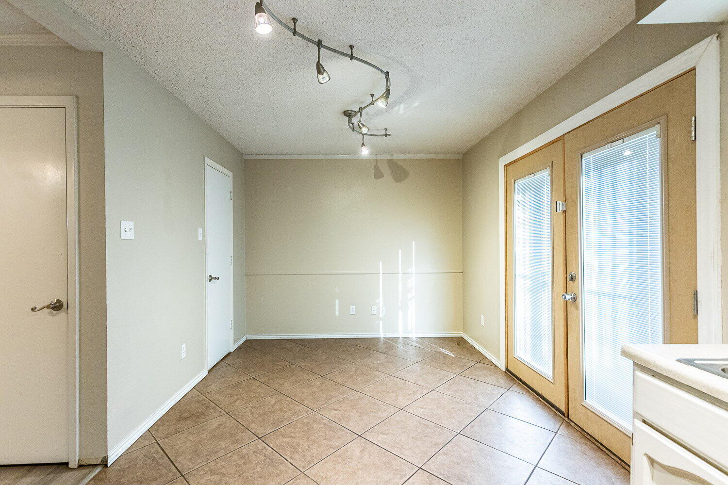 4737 48th Street Lubbock, TX 79414 - Photo 18 of 34 a view of a livingroom with a chandelier