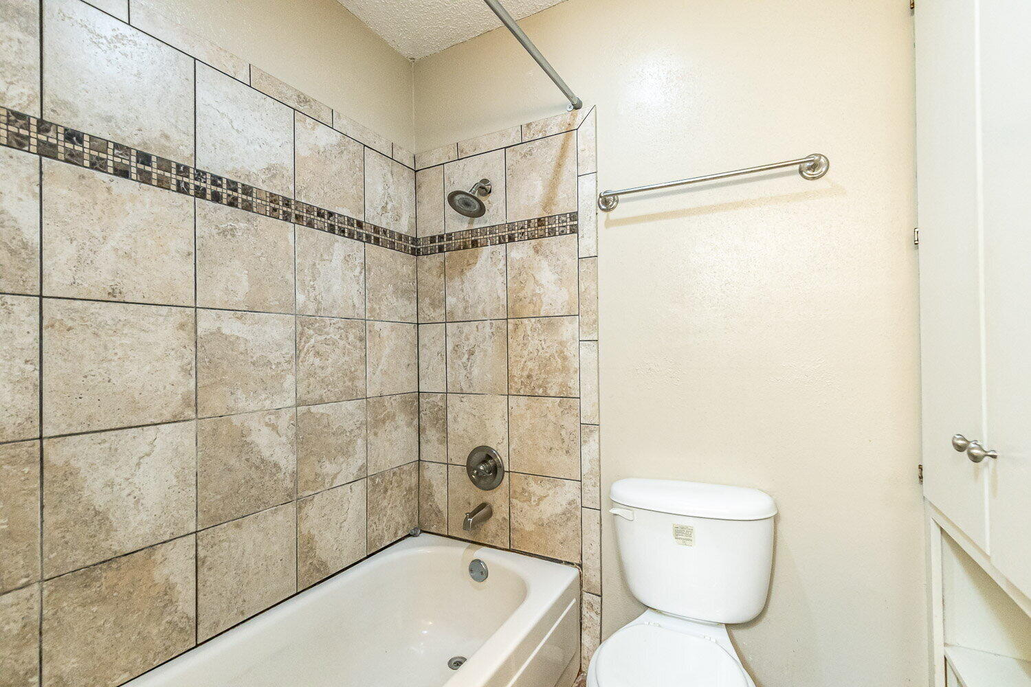 4737 48th Street Lubbock, TX 79414 - Photo 26 of 34 a bathroom with a toilet bathtub and shower