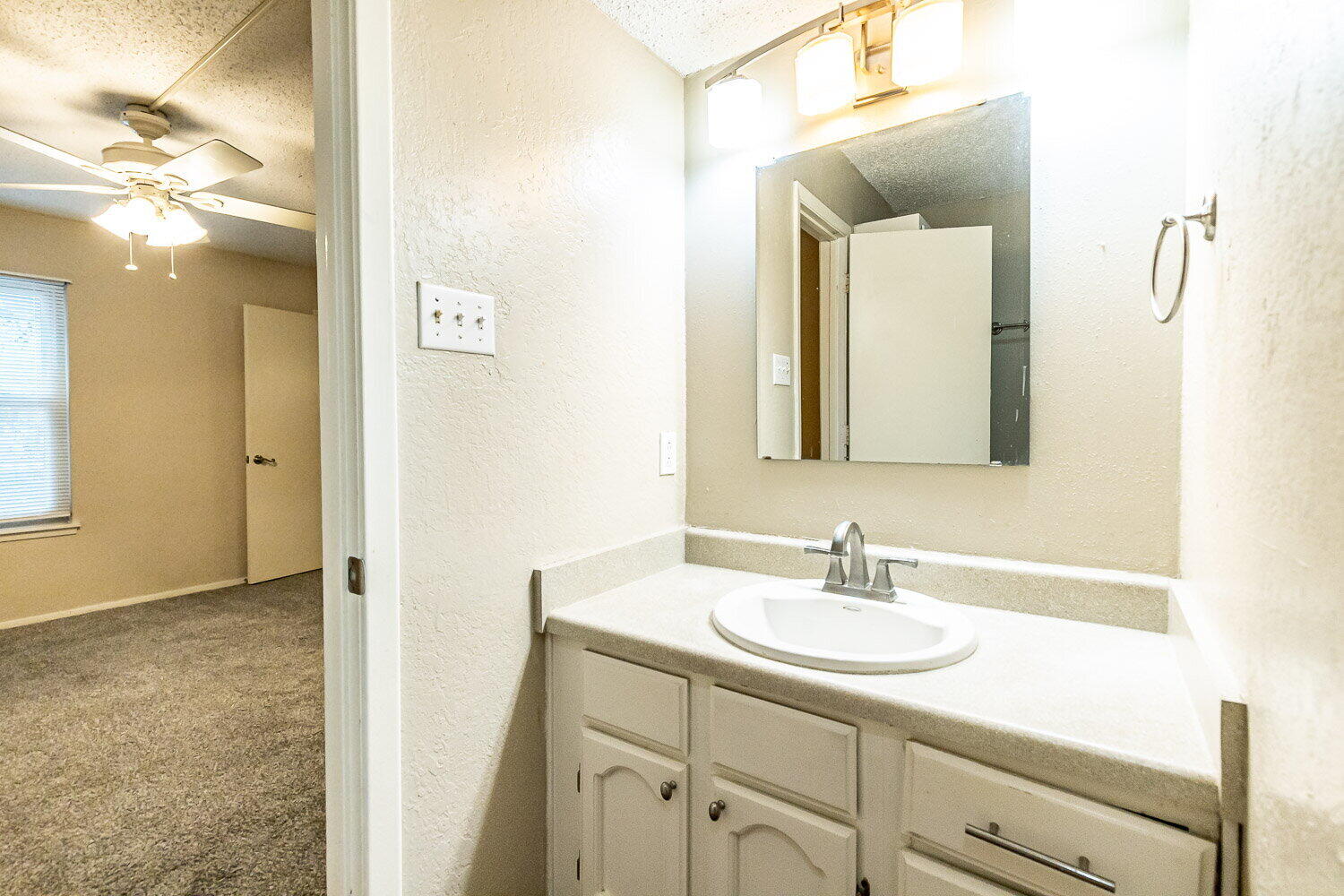 4737 48th Street Lubbock, TX 79414 - Photo 27 of 34 a bathroom with a sink double vanity and a mirror