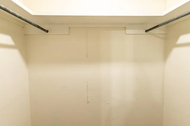 a bathroom with a double vanity sink toilet mirror and shower