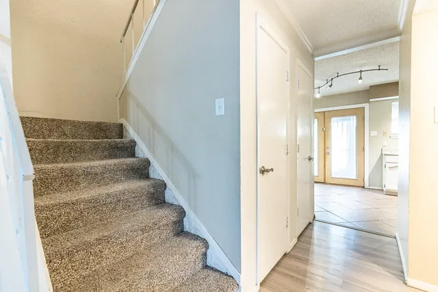 a view of an entryway with wooden floor
