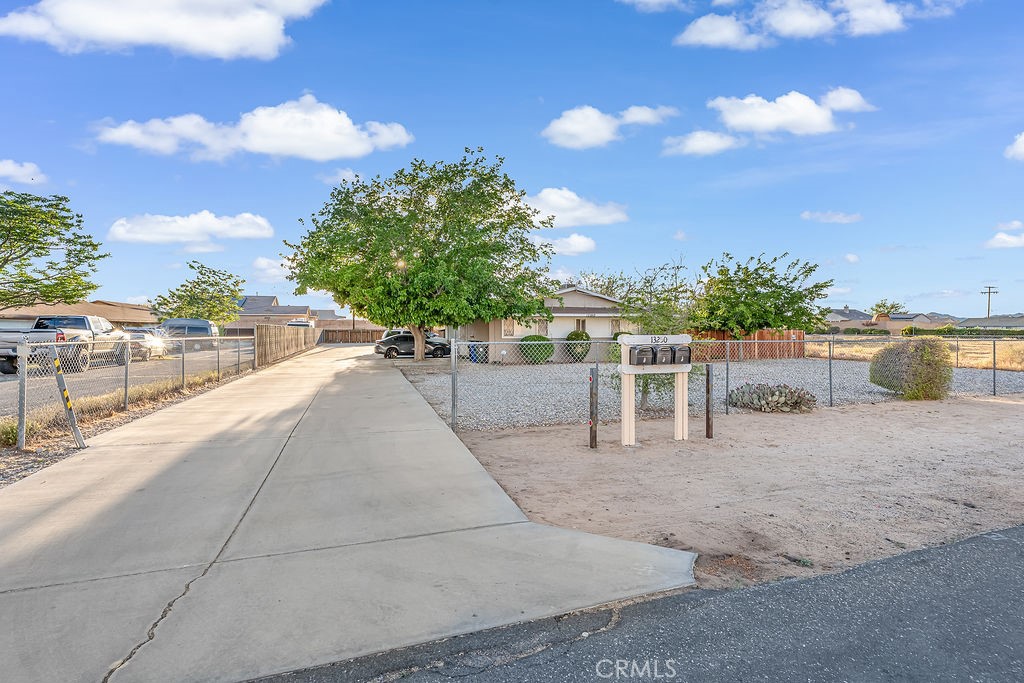 13250 Mohawk Road Apple Valley, CA 92308 - Photo 11 of 16 a view of a terrace with a bench and chairs