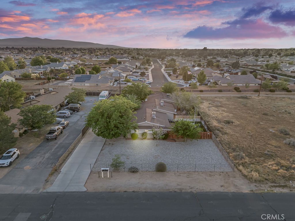13250 Mohawk Road Apple Valley, CA 92308 - Photo 12 of 16 an aerial view of residential houses with outdoor space