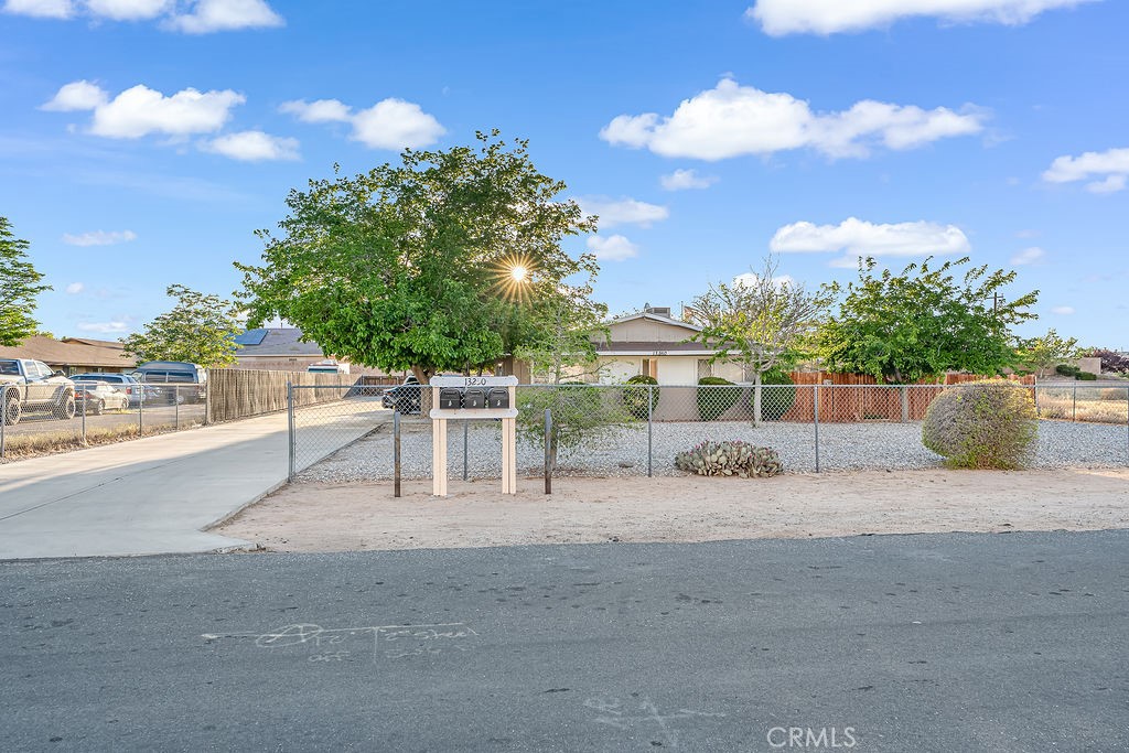 13250 Mohawk Road Apple Valley, CA 92308 - Photo 2 of 16 a view of a park with iron fence