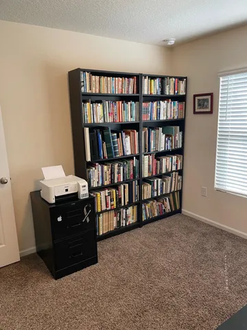 a view of a workspace with furniture