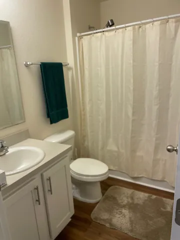 a bathroom with a shower and a bath tub