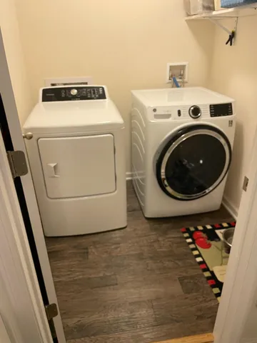 a view of a porch with furniture and garden