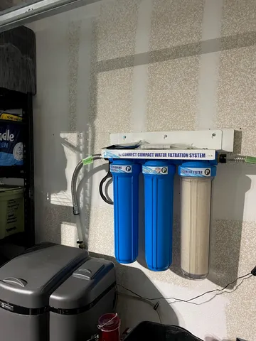 a view of a house with backyard sitting area and swimming pool