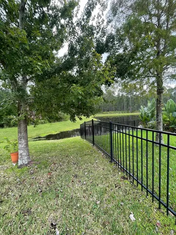 front view of a house with potted plants