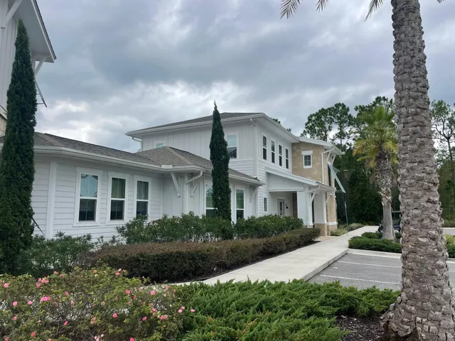 a swimming pool with outdoor seating and yard