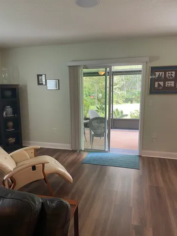 a bedroom with a bed and glass window