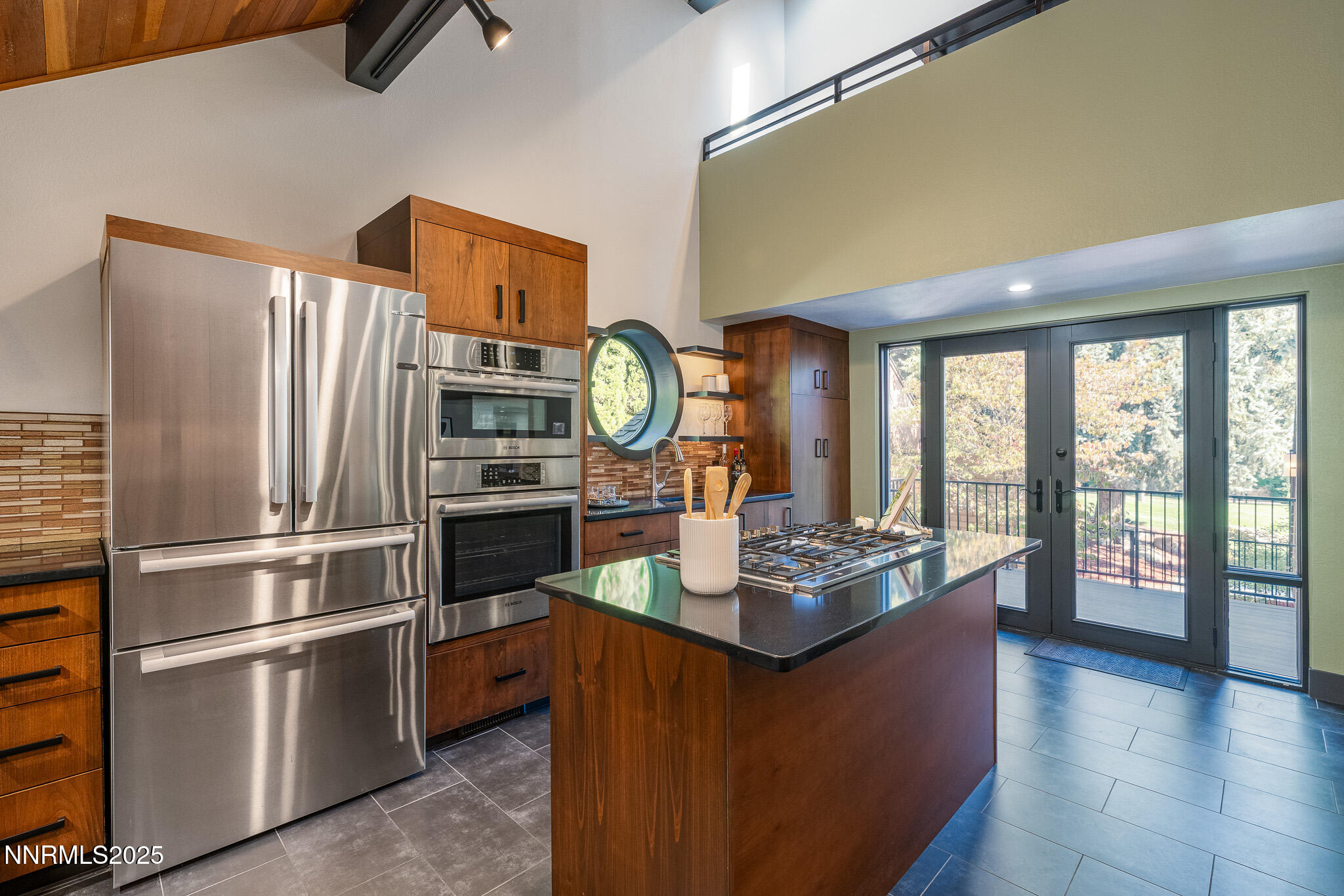 2521 Lake Ridge Shores Circle Reno, NV 89519 - Photo 18 of 54 a kitchen with stainless steel appliances granite countertop a refrigerator a stove and a sink with granite countertops