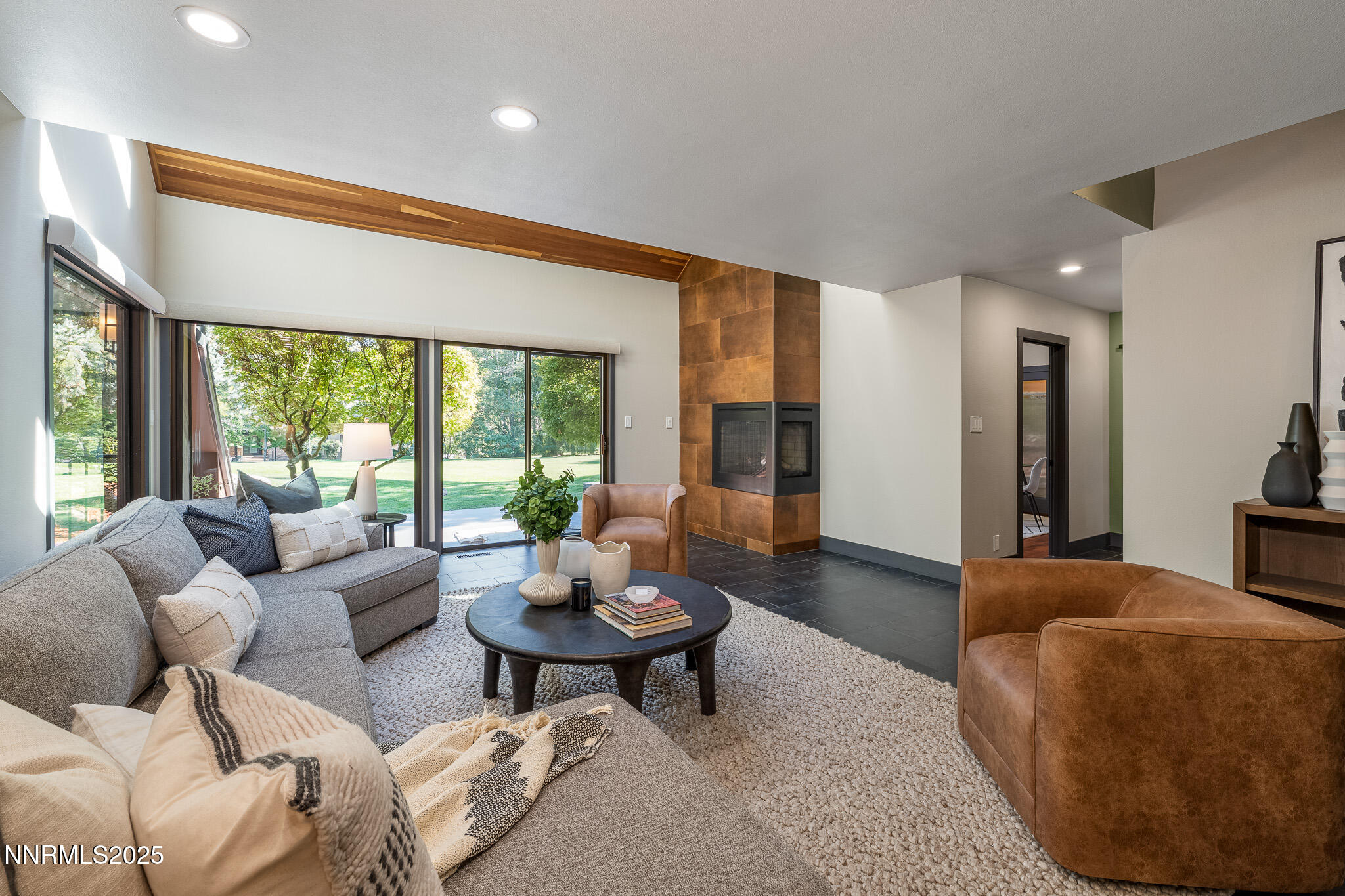 2521 Lake Ridge Shores Circle Reno, NV 89519 - Photo 19 of 54 a living room with furniture and a large window