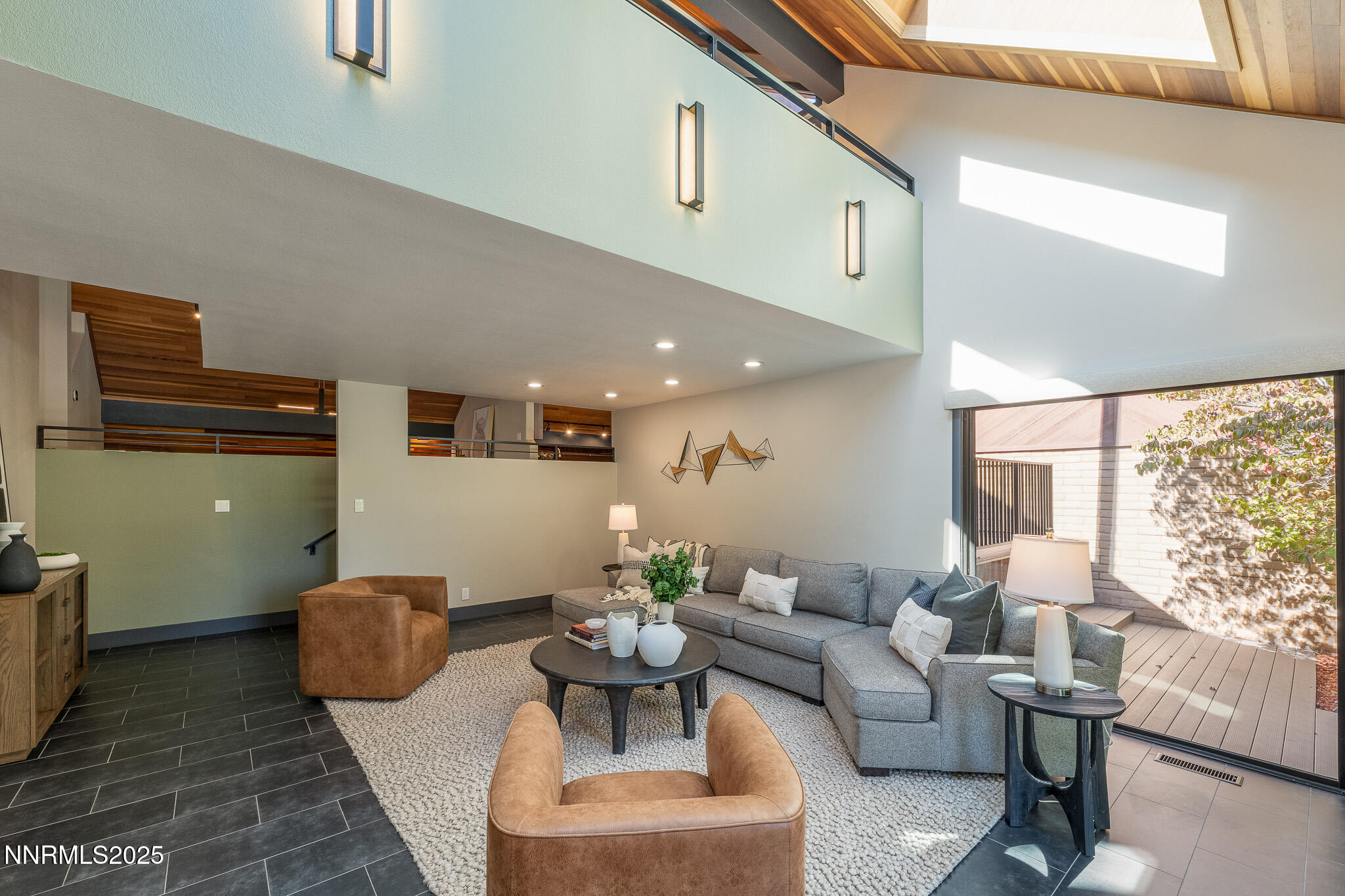 2521 Lake Ridge Shores Circle Reno, NV 89519 - Photo 21 of 54 a living room with furniture and a large window