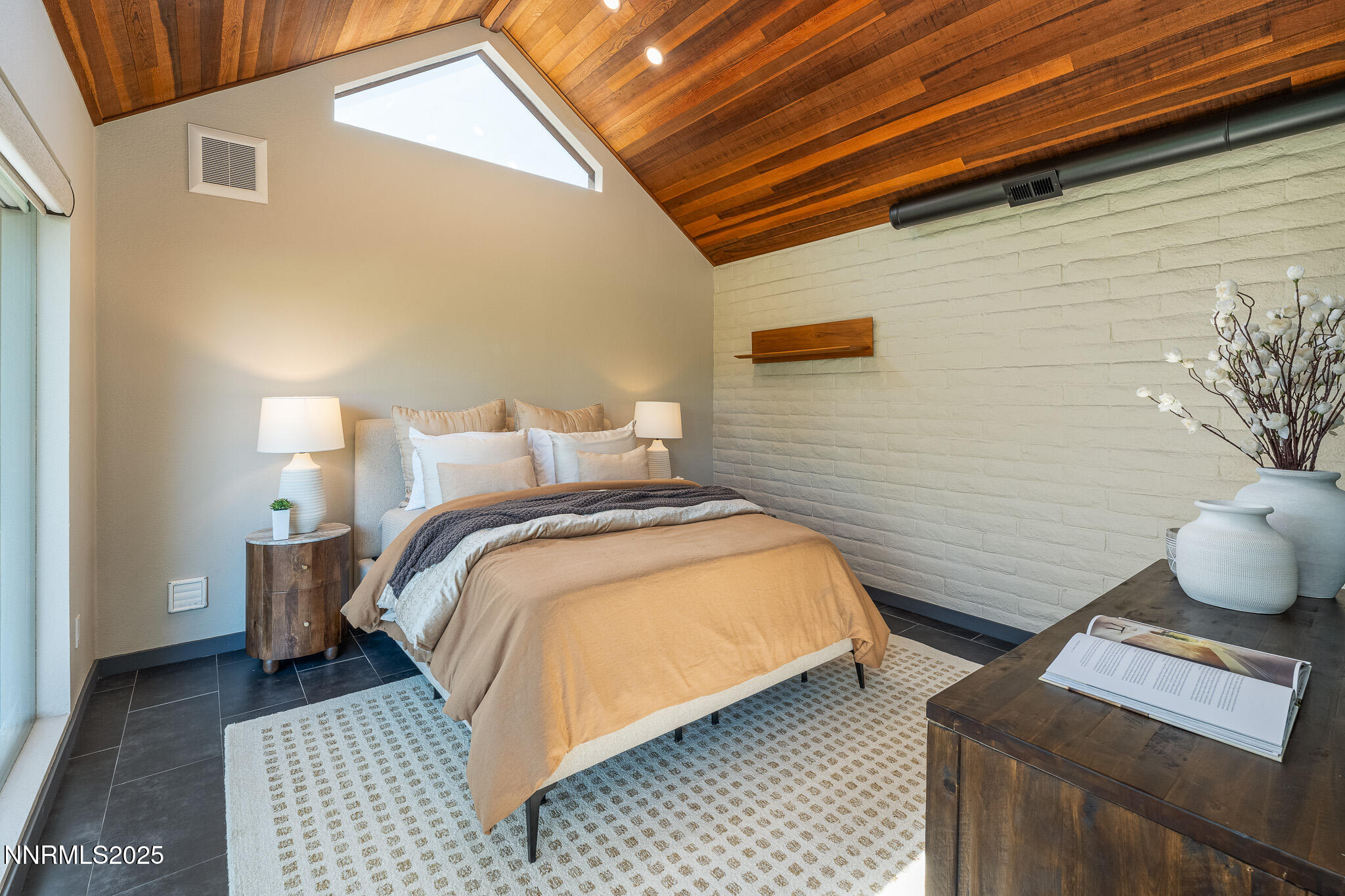 2521 Lake Ridge Shores Circle Reno, NV 89519 - Photo 27 of 54 a bedroom with bed and a night stand