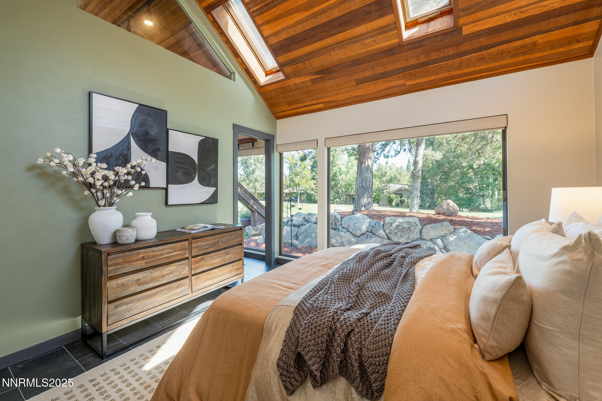 2521 Lake Ridge Shores Circle Reno, NV 89519 - Photo 28 of 54 a bedroom with a bed mirror and window