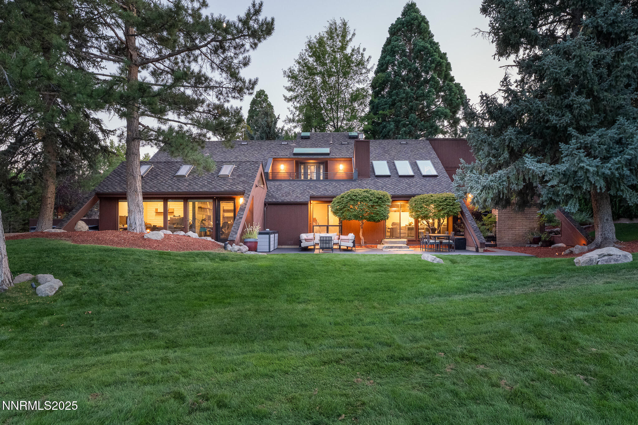 2521 Lake Ridge Shores Circle Reno, NV 89519 - Photo 3 of 54 a front view of a house with a yard