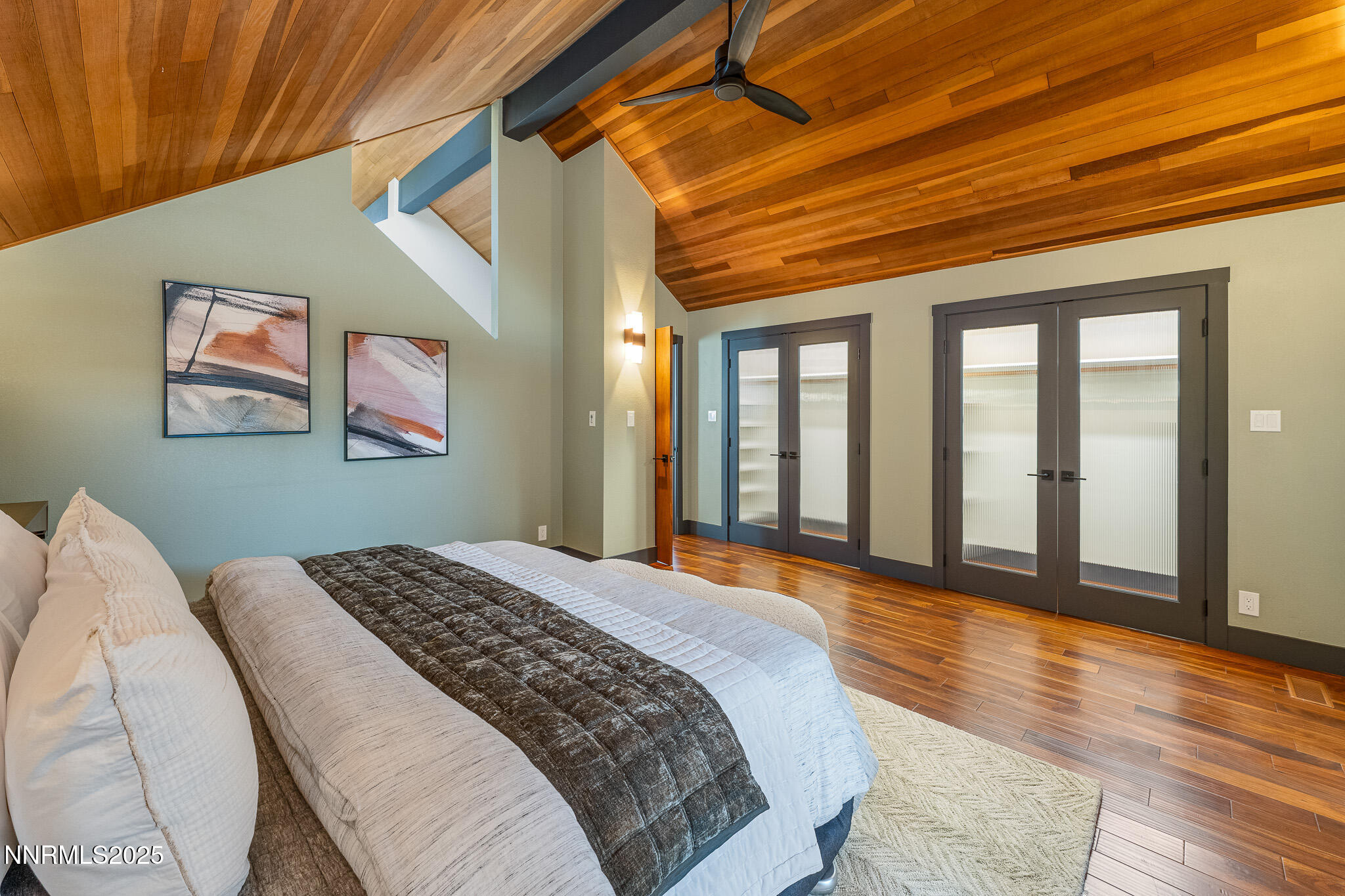 2521 Lake Ridge Shores Circle Reno, NV 89519 - Photo 34 of 54 a bedroom with a large bed and a large window