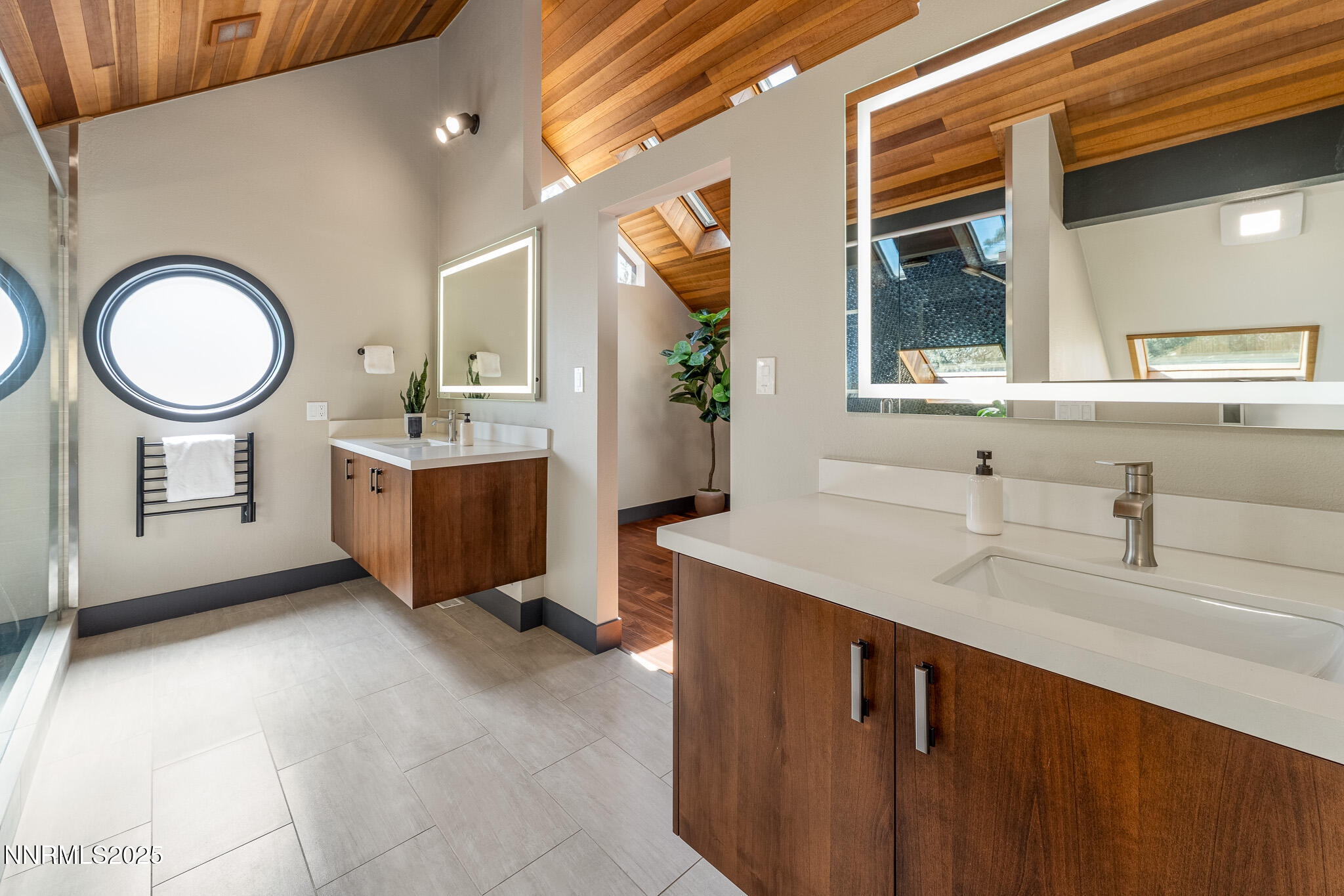 2521 Lake Ridge Shores Circle Reno, NV 89519 - Photo 37 of 54 a spacious bathroom with a double vanity sink a mirror and a toilet