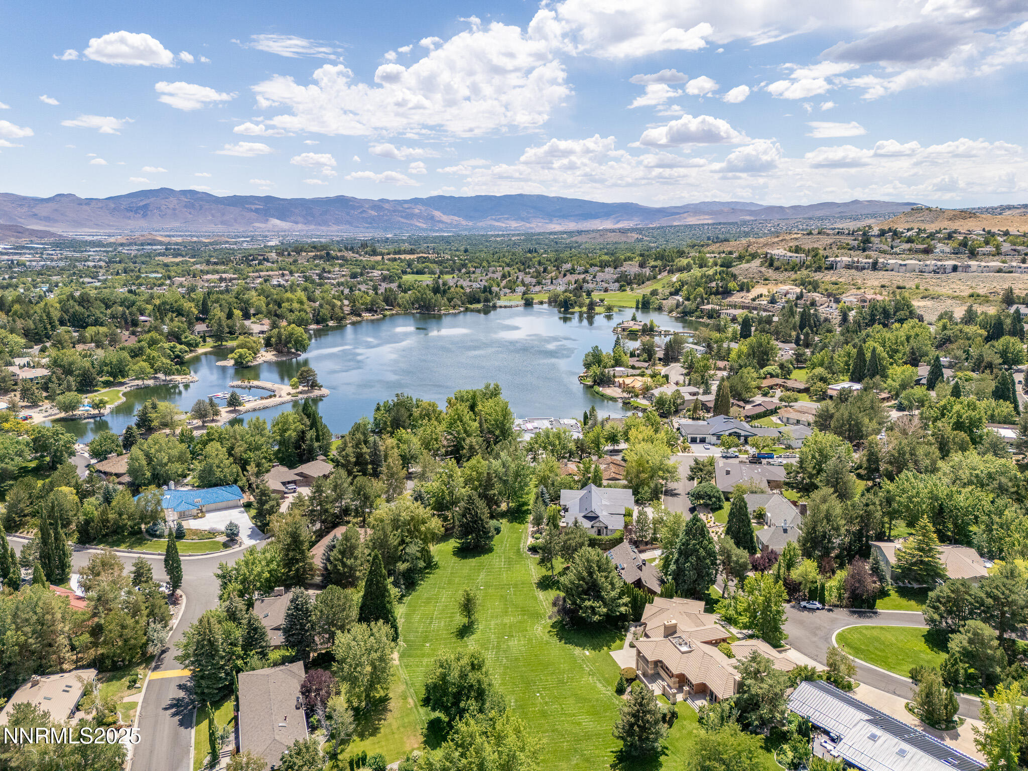 2521 Lake Ridge Shores Circle Reno, NV 89519 - Photo 51 of 54 a view of a city with mountains in the background
