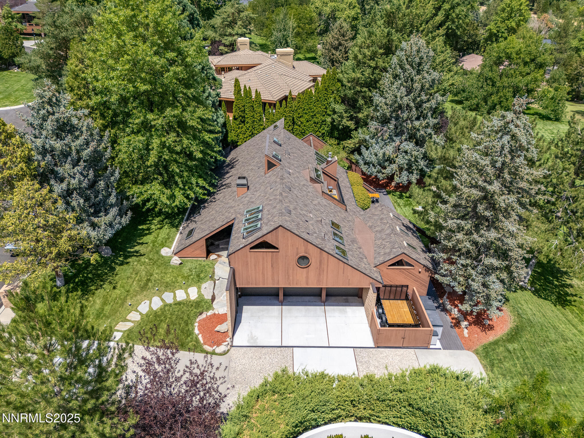 2521 Lake Ridge Shores Circle Reno, NV 89519 - Photo 10 of 54 an aerial view of a house with a yard and large trees