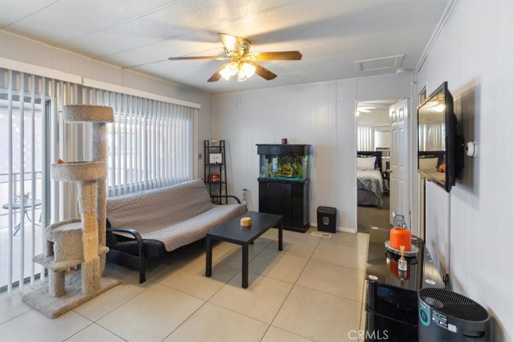 300 North Rampart Street, Unit 195 Orange, CA 92868 - Photo 10 of 25 a living room with furniture and a chandelier