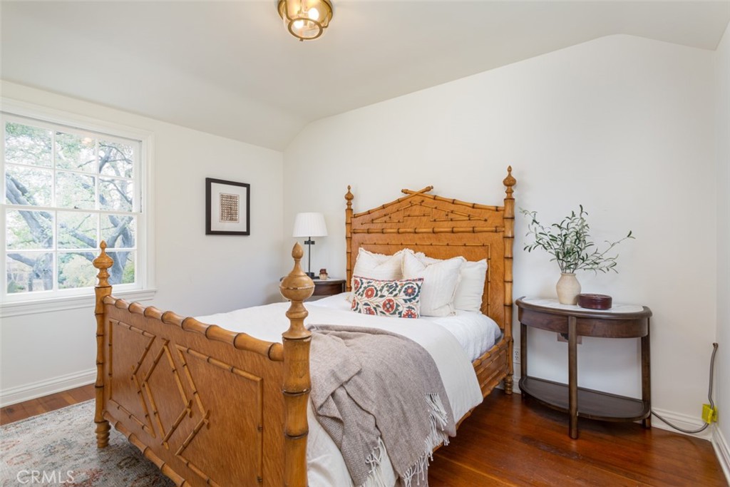 2435 Ridgeway Road San Marino, CA 91108 - Photo 15 of 38 a bedroom with double bed and a potted plant