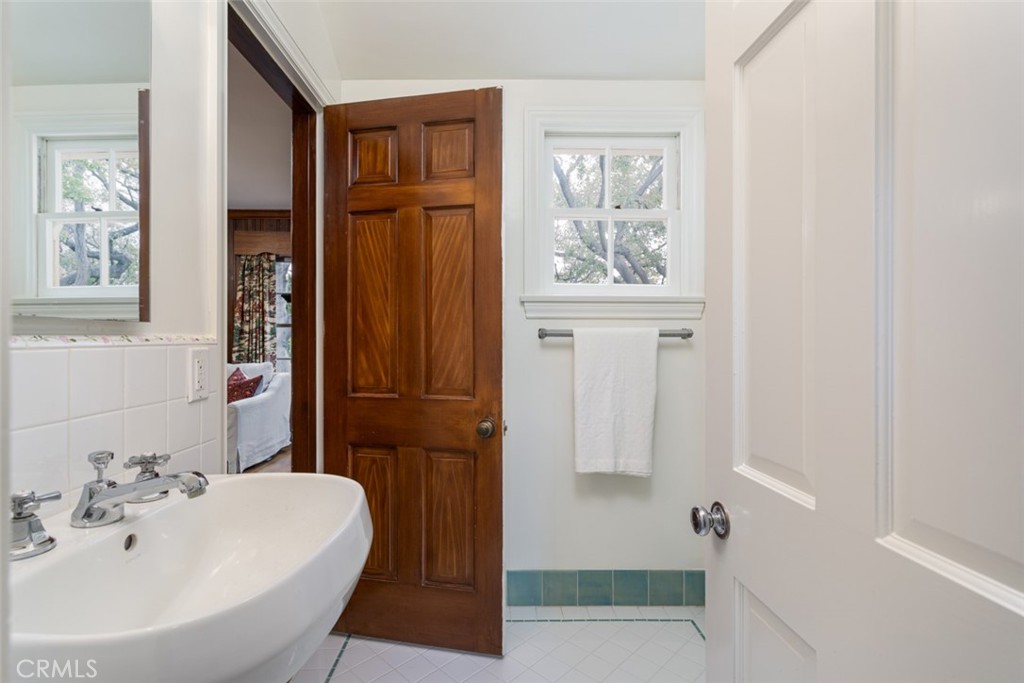 2435 Ridgeway Road San Marino, CA 91108 - Photo 16 of 38 a bathroom with a sink a toilet and shower