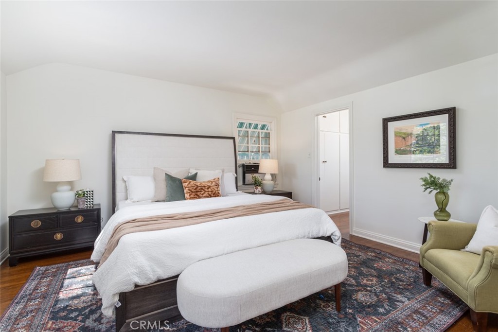 2435 Ridgeway Road San Marino, CA 91108 - Photo 20 of 38 a bedroom with a bed and glass windows