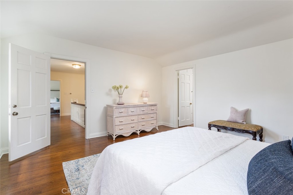 2435 Ridgeway Road San Marino, CA 91108 - Photo 26 of 38 a bedroom with a bed and wooden floor