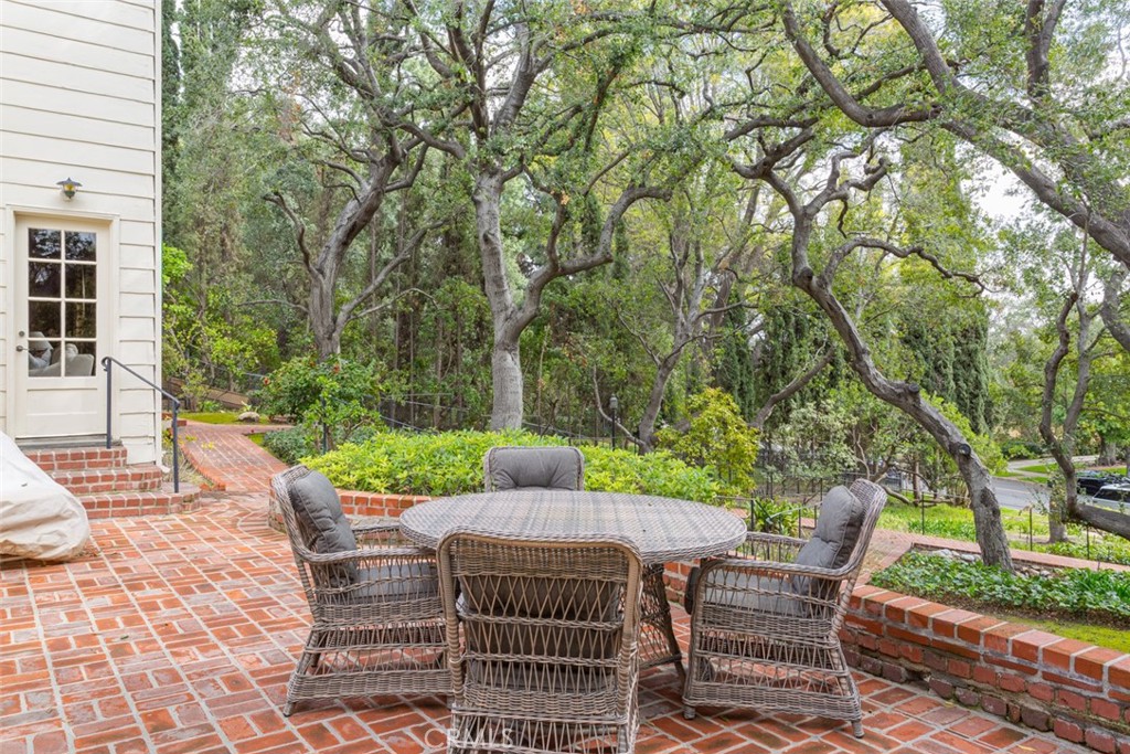 2435 Ridgeway Road San Marino, CA 91108 - Photo 34 of 38 a view of a patio with a table and chairs