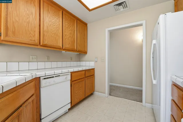 a kitchen with stainless steel appliances granite countertop a sink and cabinets