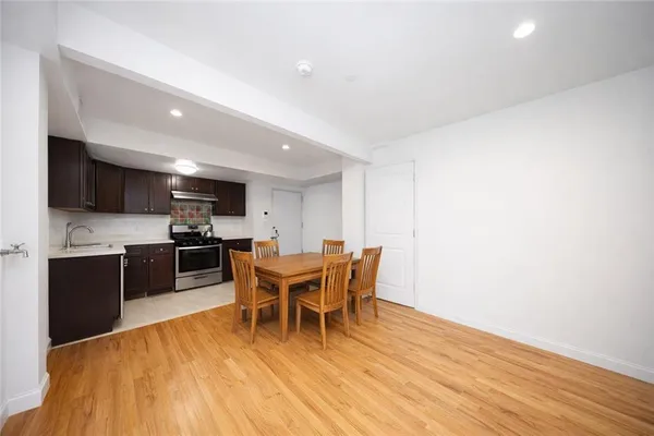 a kitchen with a stove and a cabinets