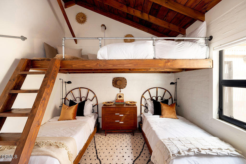 9427 T-Circle Drive Morongo Valley, CA 92256 - Photo 19 of 41 a bedroom with a bed a large window and dresser