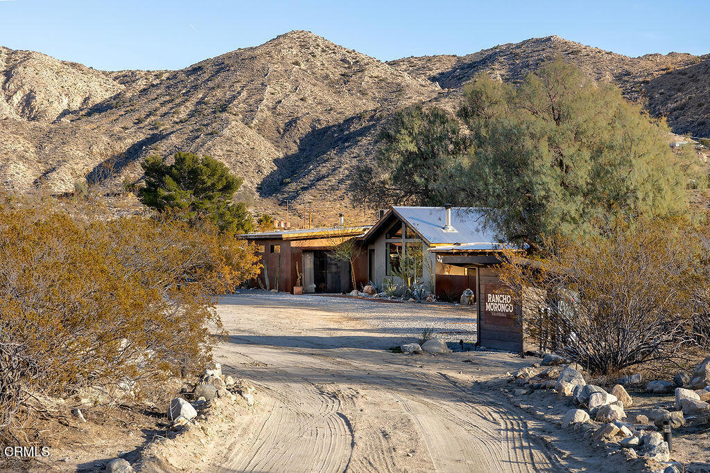 9427 T-Circle Drive Morongo Valley, CA 92256 - Photo 2 of 41 front view of a house with a mountain