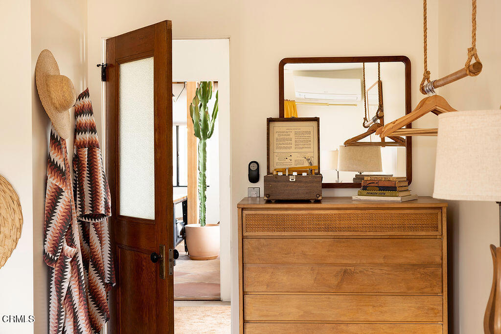 9427 T-Circle Drive Morongo Valley, CA 92256 - Photo 21 of 41 a living room with furniture a large window and storage
