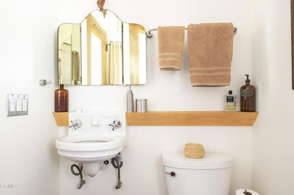 9427 T-Circle Drive Morongo Valley, CA 92256 - Photo 22 of 41 a bathroom with a sink and a mirror
