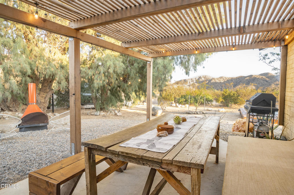 9427 T-Circle Drive Morongo Valley, CA 92256 - Photo 29 of 41 a view of a patio with a table chairs and a patio