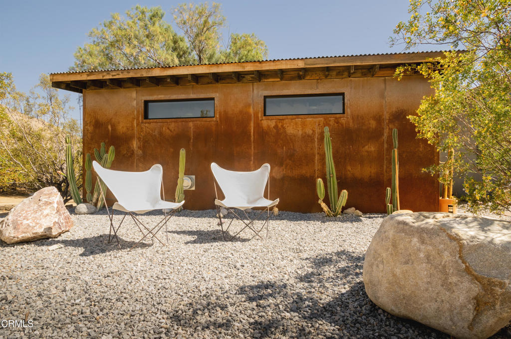 9427 T-Circle Drive Morongo Valley, CA 92256 - Photo 30 of 41 a backyard of a house with table and chairs