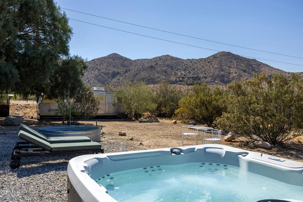 9427 T-Circle Drive Morongo Valley, CA 92256 - Photo 35 of 41 a view of a backyard with a tub