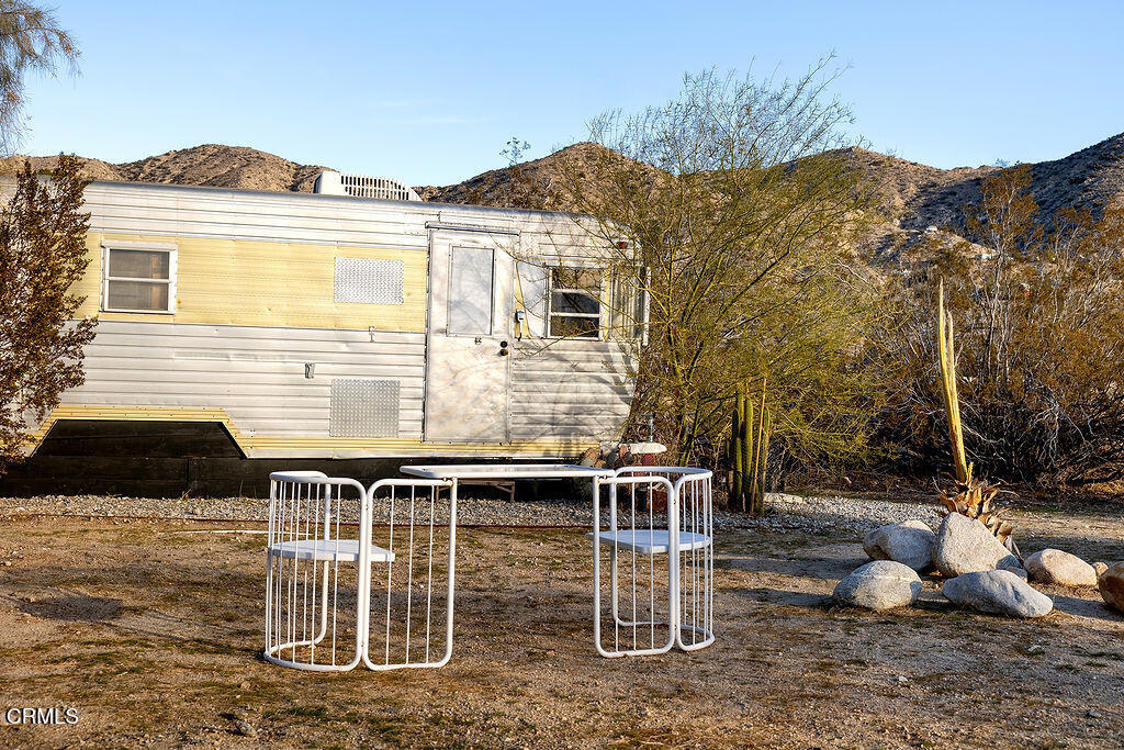 9427 T-Circle Drive Morongo Valley, CA 92256 - Photo 36 of 41 a backyard of a house with table and chairs