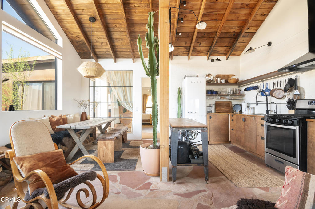 9427 T-Circle Drive Morongo Valley, CA 92256 - Photo 8 of 41 a living room with lots of furniture and a chandelier
