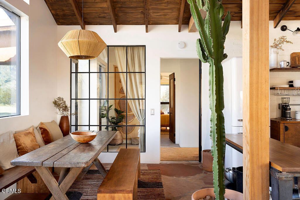9427 T-Circle Drive Morongo Valley, CA 92256 - Photo 9 of 41 a dining room with furniture and window