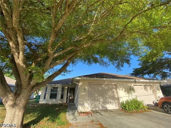 a view of a house with a yard