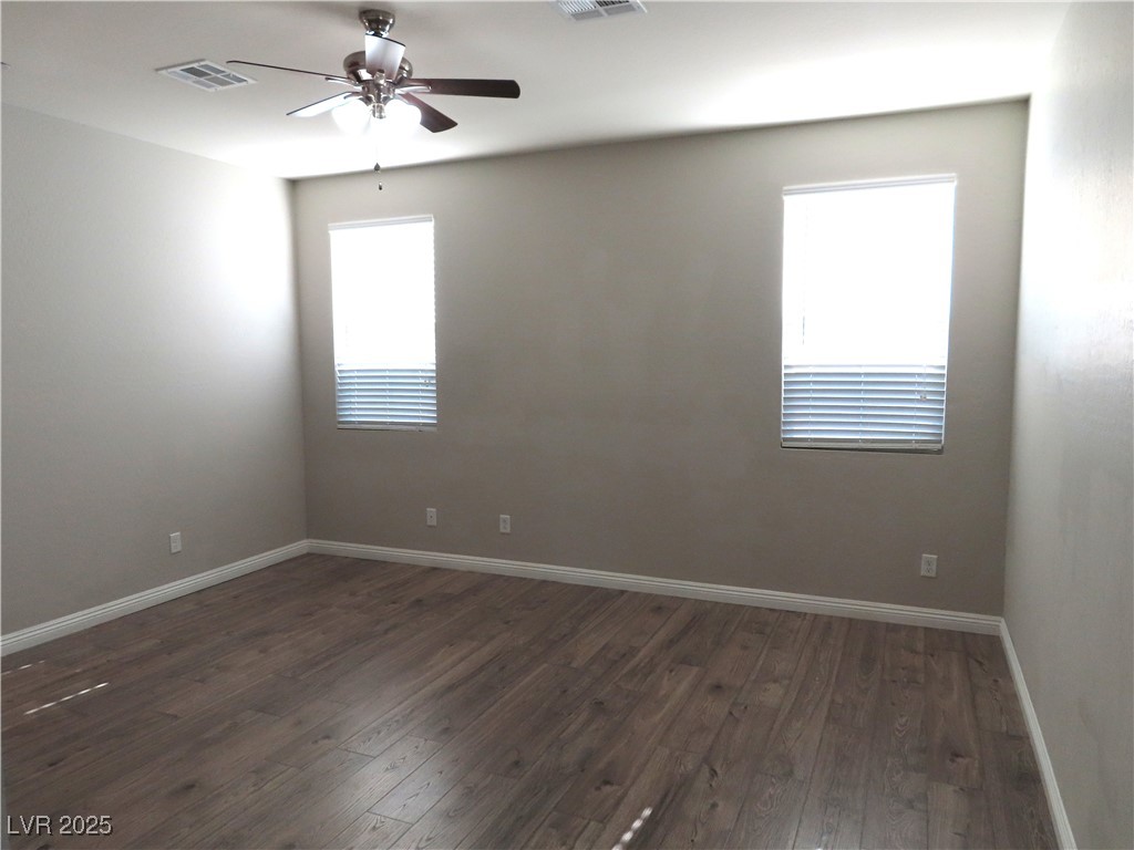 2771 Alta Vista Street Henderson, NV 89044 - Photo 23 of 55 Primary bedroom has ceiling fan, LVP floors and customized walk-in closet