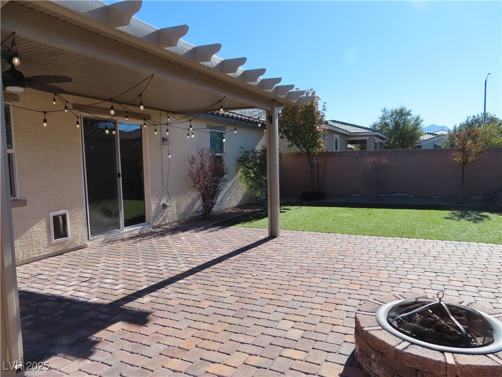 2771 Alta Vista Street Henderson, NV 89044 - Photo 3 of 55 Spacious backyard with covered paver patio, fire pit, party lights and mature landscaping
