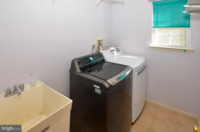 a utility room with washer and dryer