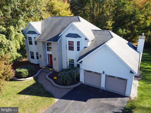 a aerial view of a house with a yard