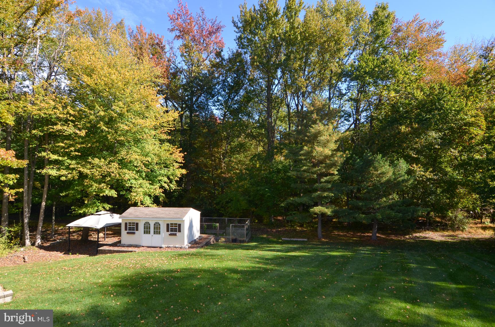 9 Noa Court Hamilton, NJ 08690 - Photo 42 of 47 a white house with a yard and sitting area