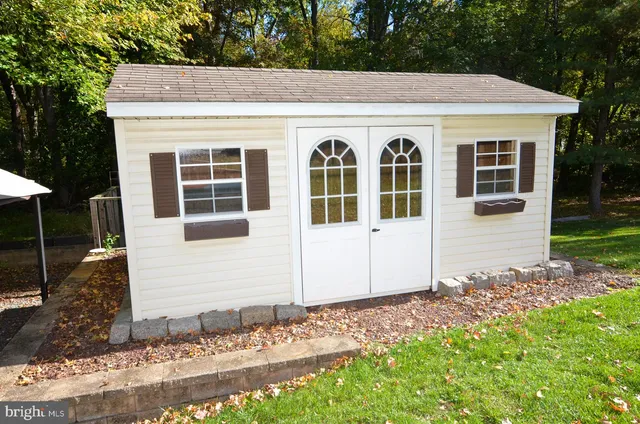 a view of backyard with swimming pool and outdoor seating
